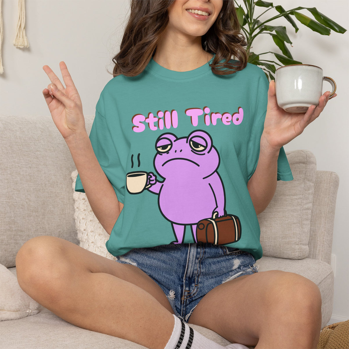 Still Tired Frog T-Shirt — Cute Exhausted Frog with Coffee & Luggage Graphic